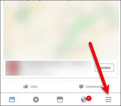 Нажмите кнопку меню в приложении Facebook в iOS.